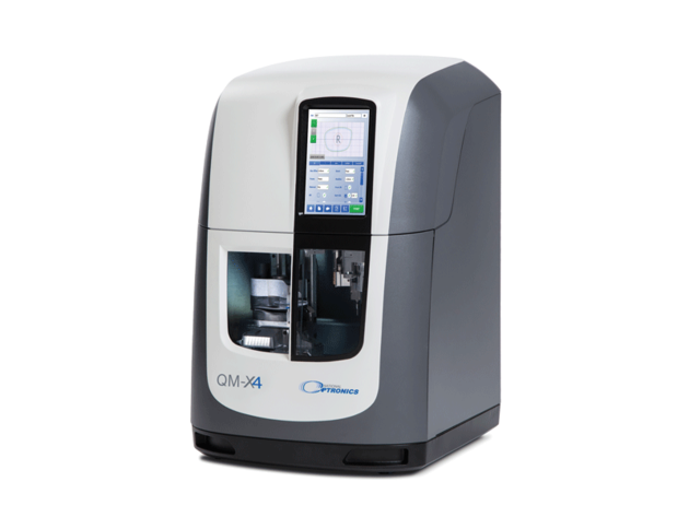 Compact optical lens processing machine with touchscreen control panel.