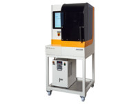 Compact automated industrial machine on wheels with control monitor, used for precise manufacturing tasks