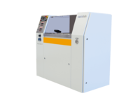 Compact industrial machine with control panel and protective cover used in semiconductor processing.