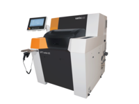 Automated industrial machine with side touchscreen control monitor for precise manufacturing processes.