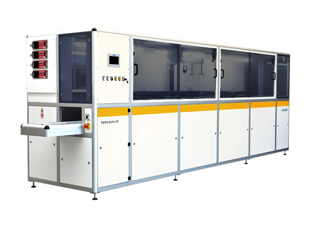 Industrial semiconductor processing system with long enclosed structure and conveyor access point.