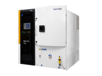 Modern semiconductor processing equipment with control panel and enclosed chamber.