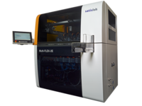 Automated industrial machine with side touchscreen monitor and enclosed working area for precision manufacturing.