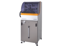 Compact automated industrial machine with transparent housing for precise manufacturing tasks
