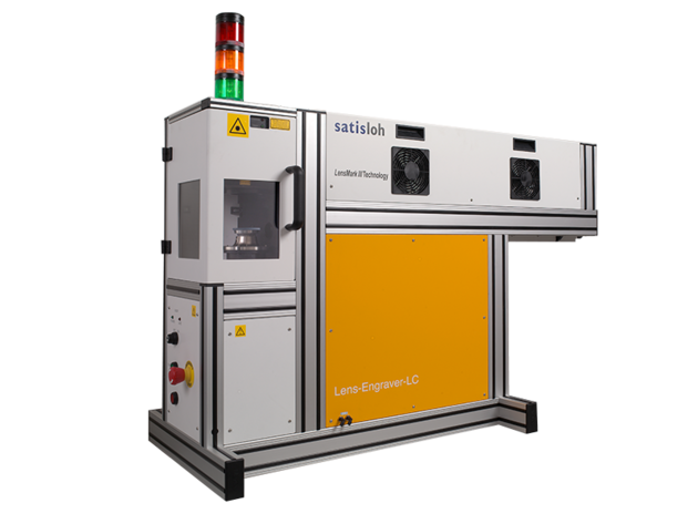 Industrial machine with orange safety enclosure and signal lights for automated production.
