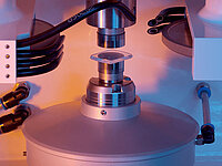 Laboratory equipment with precision tool working on a mounted square sample