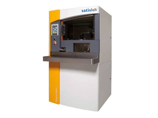 Industrial machine with control display and workspace, used for lens or optical manufacturing processes.