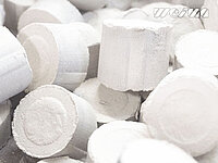 Close-up of multiple cylindrical white pellets stacked together.
