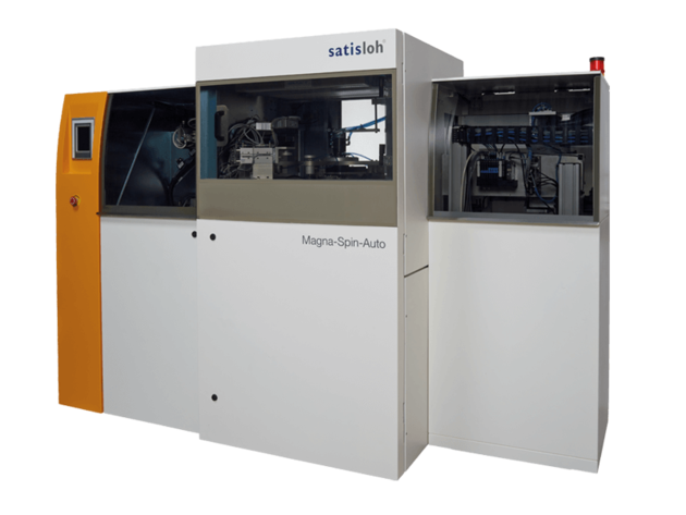 Industrial machine with multiple compartments and control panels, used for optical lens production.
