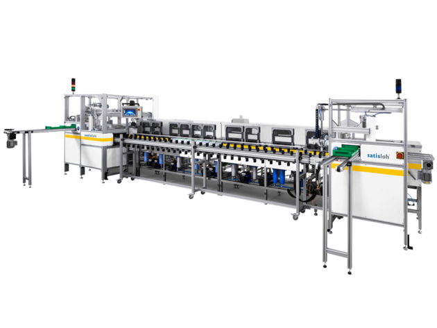 Industrial assembly line machine with multiple workstations for automated semiconductor or electronics production.