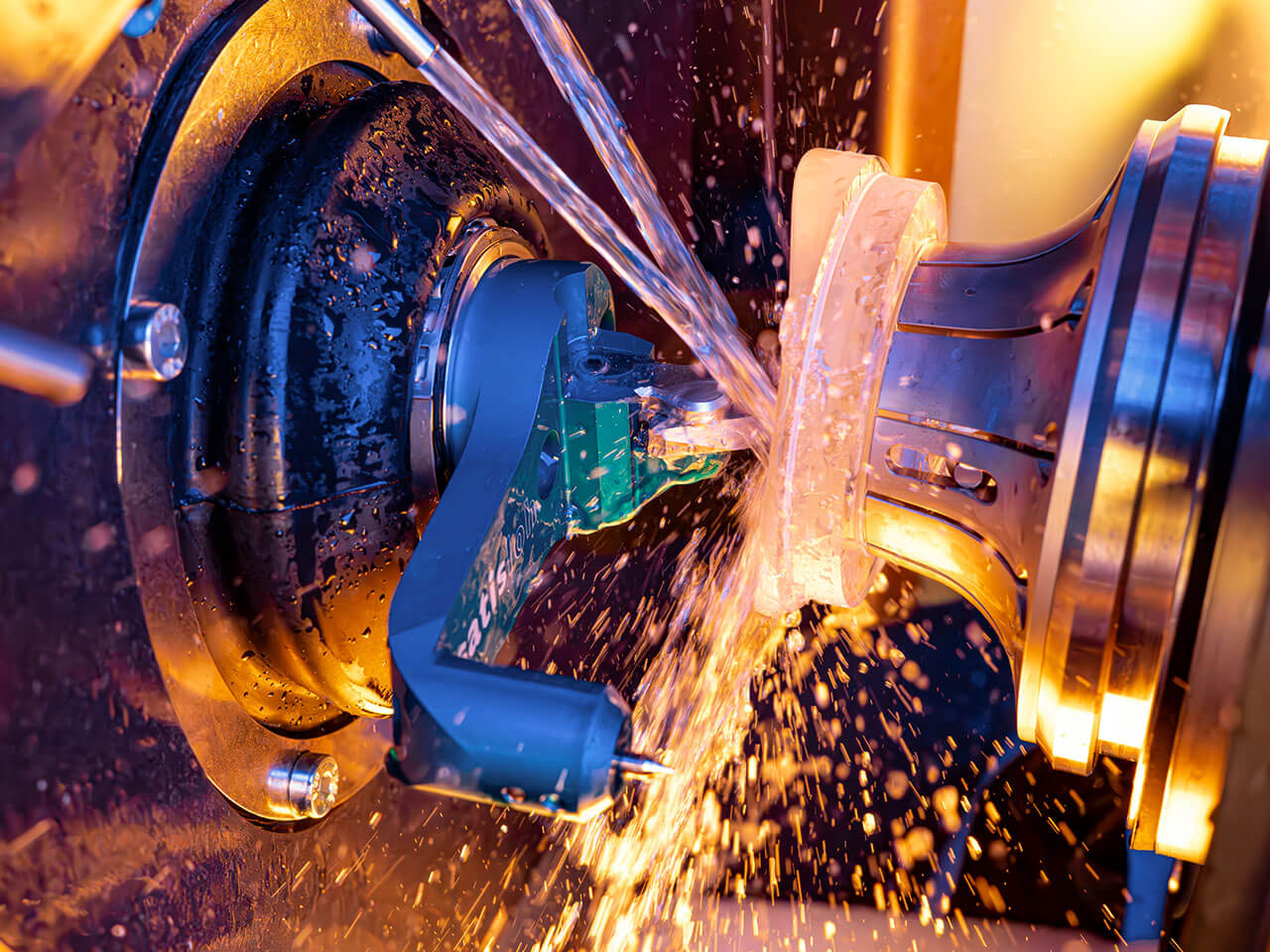 Close up of an industrial machine precisely engraving a glass lens in a holder.