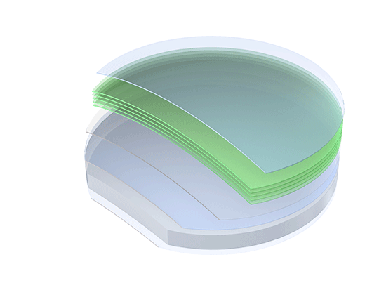 Stack of semiconductor wafers with a green-tinted protective layer on top.