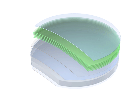 Stack of semiconductor wafers with a green-tinted protective layer on top.