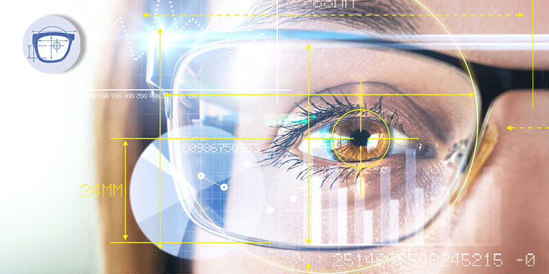 Close-up of a person’s eye wearing glasses with digital yellow interface graphics overlayed, symbolizing vision technology or augmented reality.